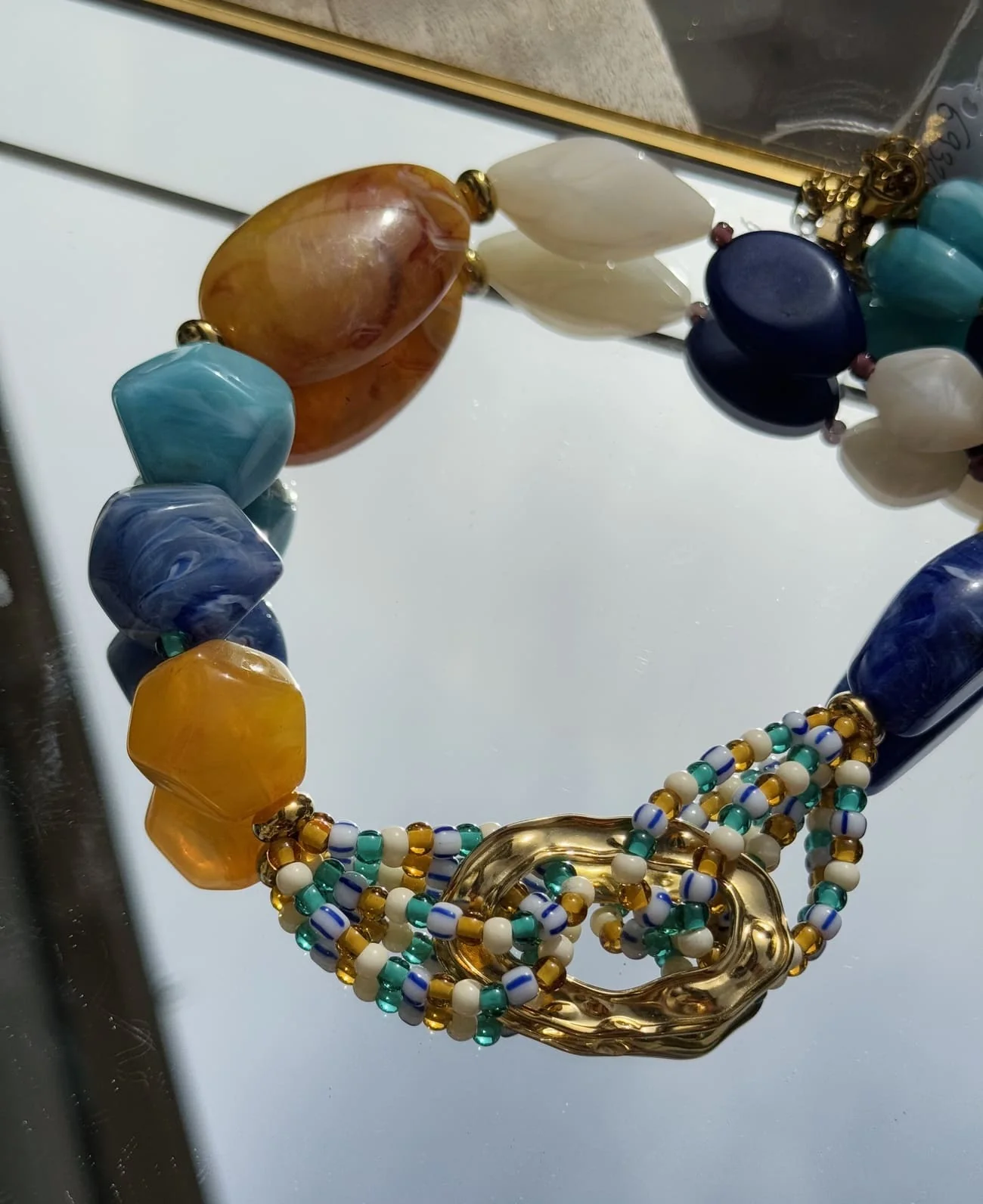 COLLIER GROSSES PIERRES BLEU ORANGE